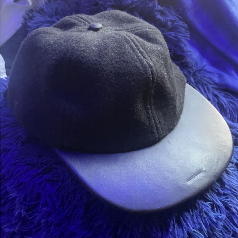 Leather coach baseball hat.